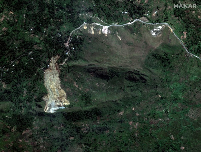 an aerial view of a landslide in dense forest