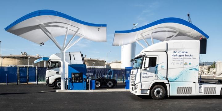 Hyundai Xcient Class 8 Fuel Cell Electric Trucks at hydrogen fueling station.