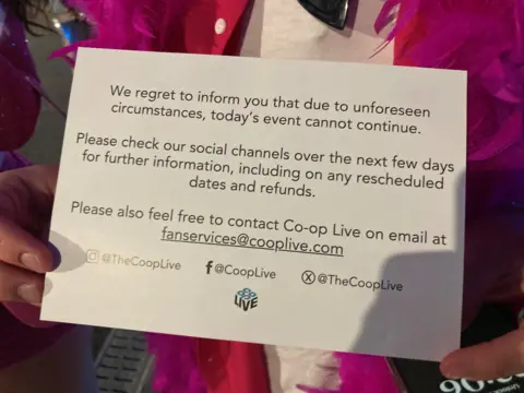 Cards carrying an announcement from Co-op Live were handed out to fans