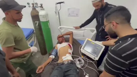 Reuters An injured man is treated at the Emirati hospital in Rafah, in the southern Gaza Strip (29 May 2024)