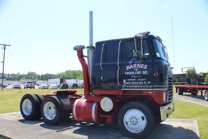 A restored Barnes cabover tractor.