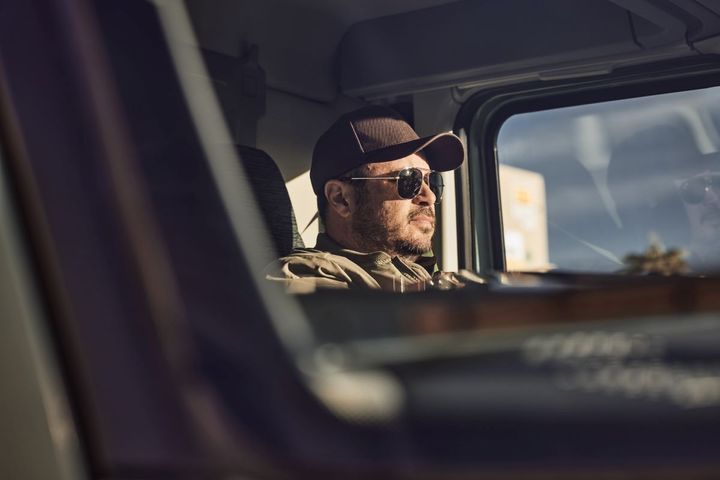 Trucker driving a Volvo VNL.