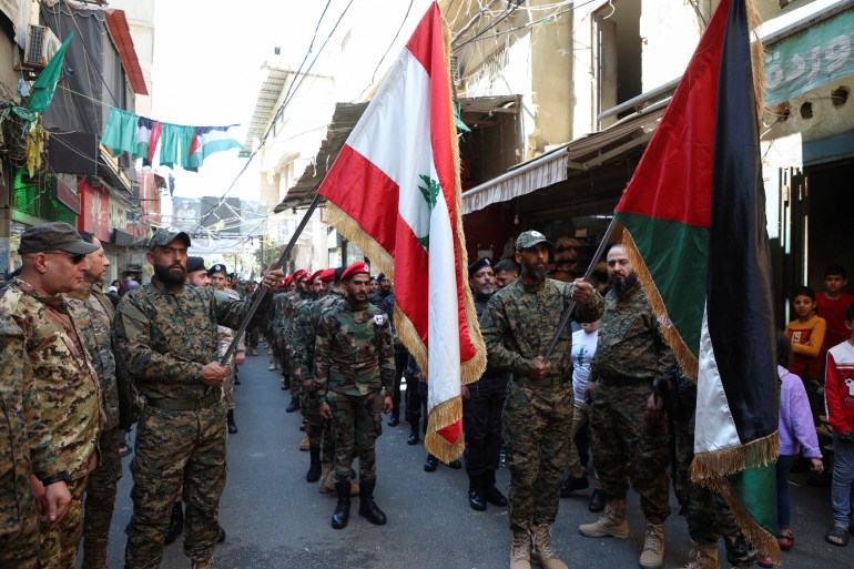 Members of the Popular Front for the Liberation of Palestine-General Command (PFLP-GC) march during a parade marking the annual al-Quds Day, (Jerusalem Day), at Burj al-Barajneh Palestinian refugee camp in Beirut, Lebanon