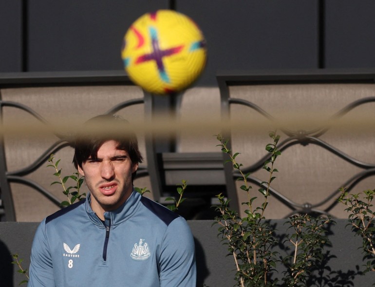 Football player watching training.