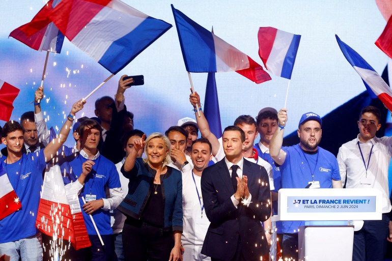 Marine Le Pen, President of the French far-right National Rally (Rassemblement National - RN) party parliamentary group, and Jordan Bardella, President of the French far-right National Rally (Rassemblement National - RN) party and head of the RN list for the European elections, attend a political rally during the party's campaign for the EU elections, in Paris, France, June 2, 2024. REUTERS/Christian Hartmann/File Photo