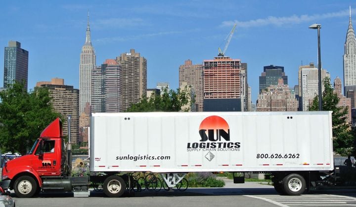 Sun Logistics tractor-trailer with New York skyline