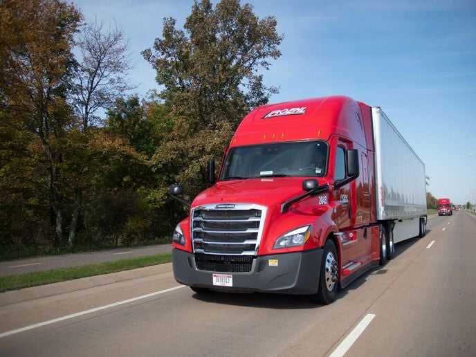 Red Roehl tractor-trailer on the highway