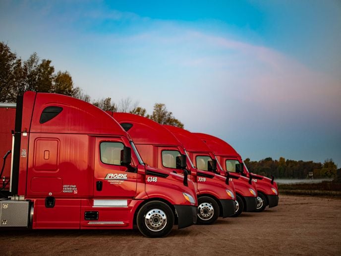 Line of red Roehl trucks