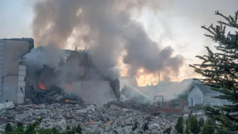 Getty Images Aftermath of hit residential area in Kharkiv in May 2024