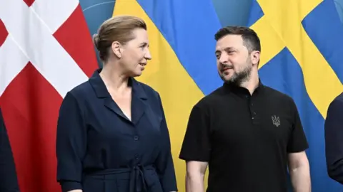 Reuters Denmark's Prime Minister Mette Frederiksen with Ukrainian President Volodymyr Zelenskiy