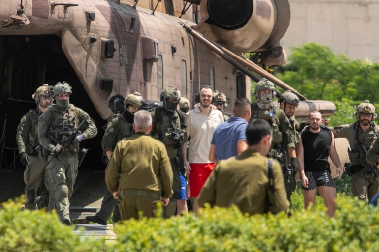 Andrey Kozlov, 27, left, and Almog Meir Jan, 21, two of four hostages who were kidnapped in a Hamas-led attack on Oct. 7, 2023, and were just rescued, arrive by helicopter to the Sheba Medical Center in Ramat Gan, Israel, Saturday, June 8