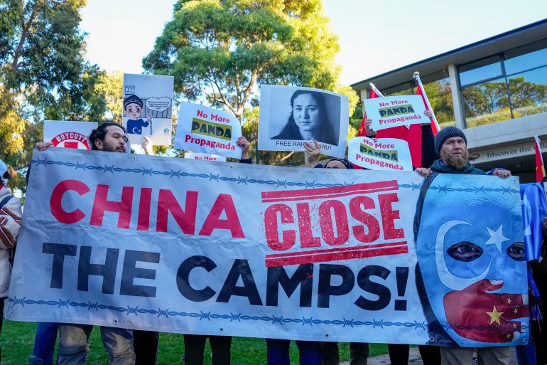 Protesters call on China to 'close the camps' in reference to Xinjiang where the UN has said at least one million mostly Muslim Uighurs have been detained in re-education centres