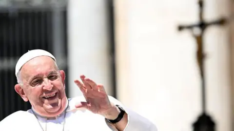 EPA Pope Francis greets faithful during his Wednesday general audience in Saint Peter's Square at the Vatican, 12 June 2024.