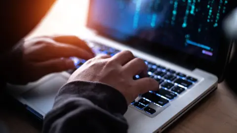 Getty Images Man using a laptop