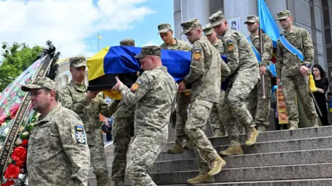 Getty Images Ukraine funeral for a killed pilot