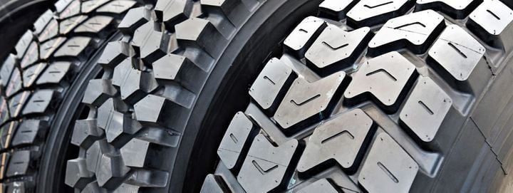 Closeup of truck tire treads.