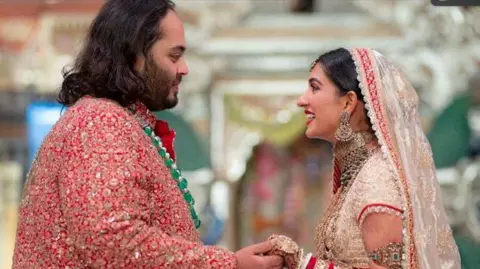 Reuters Anant Ambani and his wife Radhika Merchant at the ceremony in Mumbai