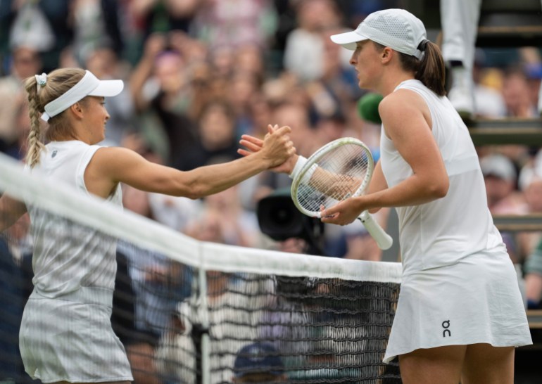 Tennis players shake hands.