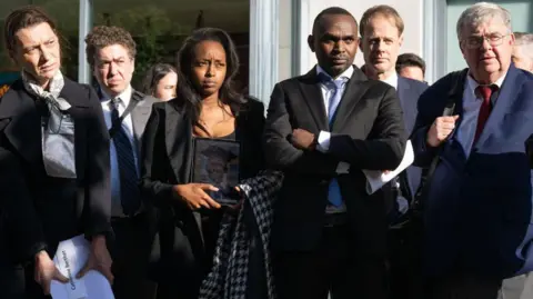 Getty Images Relatives of people killed in the Ethiopian Airlines Flight 302 Boeing 737 MAX crash hold a press conference after meeting with Department of Justice officials over concerns about how the US government has handled the criminal prosecution into Boeing, outside a government office in Washington, DC, April 24, 2024.