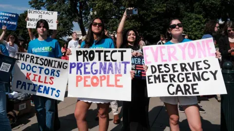 Getty Images Protesters at the Supreme Court on 28 June