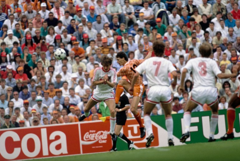 Russian footballer Vasyl Rats fails to block the shot from Dutch footballer Marco van Basten as he shoots to give the Netherlands a two-goal lead, as Russian footballers Sergei Aleinikov and Vagiz Khidiyatullin can only look on, during the UEFA Euro 1988 final between the Soviet Union and the Netherlands, held at Olympiastadion in Munich, Bavaria West Germany, 25th June 1988. The Netherlands won the match 2-0. (Photo by Bongarts/Getty Images)