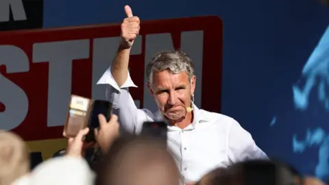 Reuters Björn Höcke, leader of the Alternative for Germany in Thuringia (AfD), gestures during an election campaign rally for the Thuringia state elections in Nordhausen, Germany, August 29, 2024.