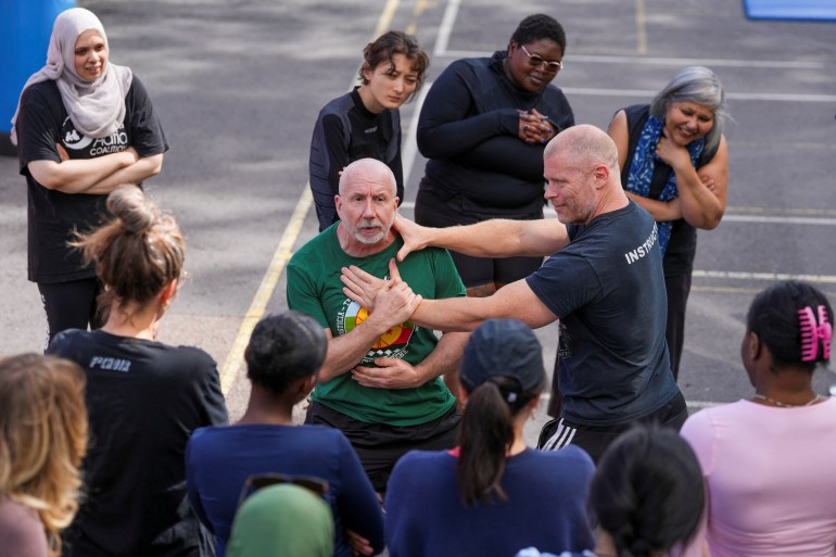 People take part in self defence classes led by Stewart McGill, in London, UK, August 10, 2024. REUTERS/Maja Smiejkowska