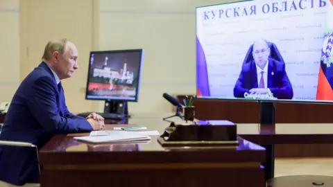 EPA Russian President Vladimir Putin holds a video conference meeting with Kursk Region Acting Governor Alexei Smirnov on 08 August