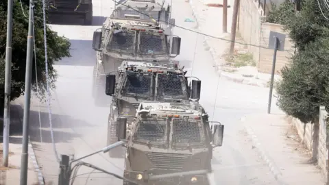 EPA Israeli troops move inside the Jenin refugee camp on the fourth day of an operation in Jenin, 31 August 2024