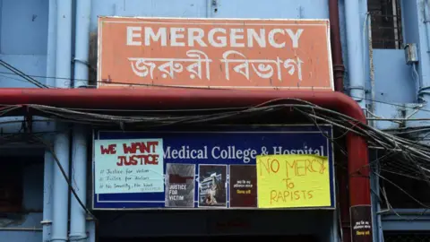 Getty Images Posters are seen outside of an emergency ward inside a Government hospital during a junior doctor strike to protest the rape and murder of a PGT woman doctor at R G Kar Medical College & Hospital in Kolkata, India, on August 11, 2024