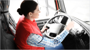 Female trucker red vest cab 1200x628.png