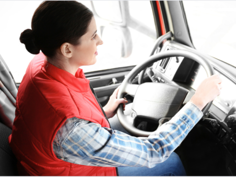 Female trucker red vest cab 1200x628.png