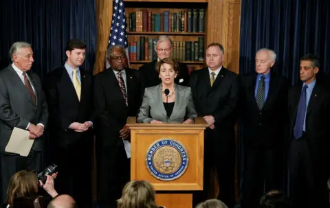 Getty Images Tim Walz next to Nancy Pelosi in 2007 