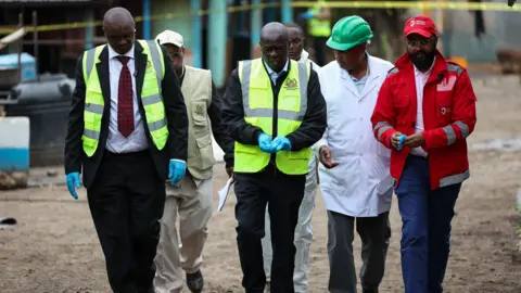 EPA Kenya's Deputy President Rigathi Gachagua and other officials walk at a school 