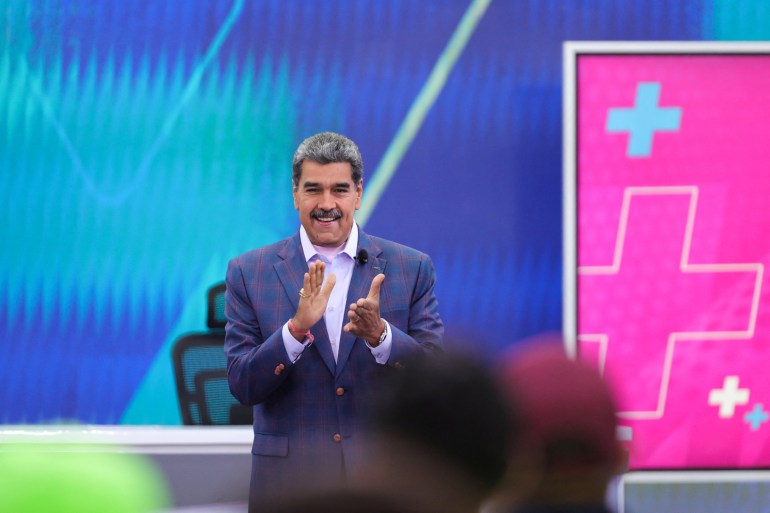 Nicolas Maduro claps on his state TV show.