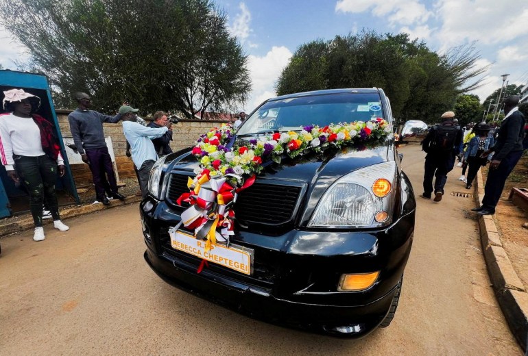 The cortege of slain Olympian Rebecca Cheptegei, who died after her former boyfriend doused her in petrol and set her ablaze, leaves the Moi Teaching & Referral Hospital (MTRH) funeral home, in Eldoret, Kenya September 13, 2024. REUTERS/Edwin Waita