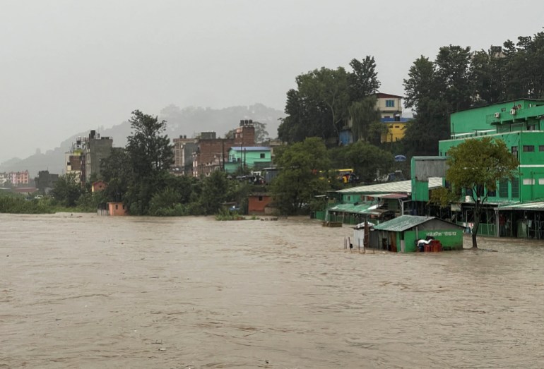 A general view of the overflowing Bagmati River following heavy rains, in Kathmandu, Nepal September 27, 2024. REUTERS/Navesh Chitrakar REFILE - CORRECTING YEAR FROM "SEPTEMBER 27, 2023" TO "SEPTEMBER 27, 2024