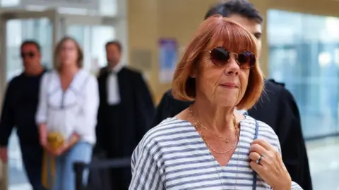 REUTERS/Manon Cruz Gisèle Pelicot who has allegedly been drugged and raped by men solicited by her husband Dominique Pelicot, followed by her lawyer Stephane Babonneau, walks at the courthouse in Avignon, France, September 10, 2024