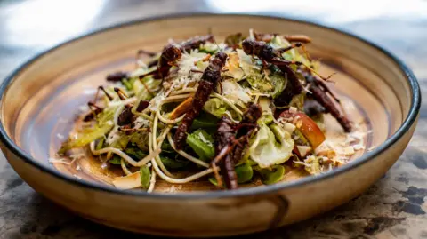 Getty Images A salad topped with crickets