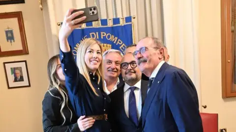 Gennaro Sangiuliano  Gennaro Sangiuliano poses with Maria Rosaria Boccia and Italian officials