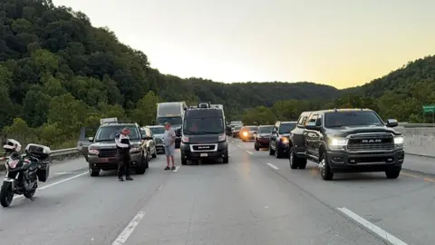 Mount Vernon Fire Department/Handout via REUTERS Drivers park on the lanes of the I-75 highway after multiple people were shot while driving 