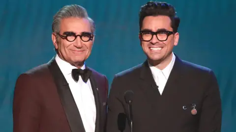 Getty Images Eugene Levy and Dan Levy speak onstage during the 26th Annual Screen Actors Guild Awards at The Shrine Auditorium on January 19, 2020 in Los Angeles, California