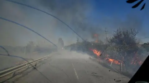 Getty Images  Fires burn along the road from Kurakhove to Hirnyk as a result of Russian artillery shelling, Pokrovsk district, Donetsk region, eastern Ukraine. (Photo credit should read Dmytro Smolienko / Ukrinform/Future Publishing via Getty Images