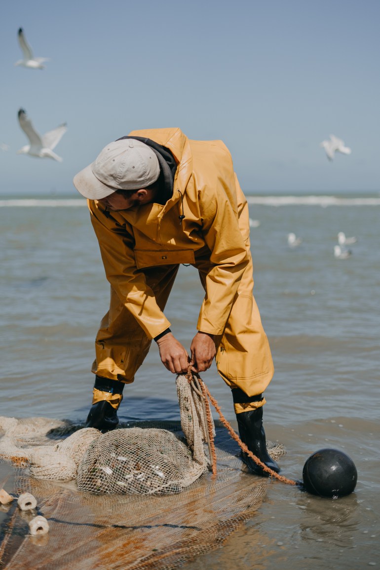 Gregory Debruyne unloads his catch following a fishing session in the North Sea. Photo by Diana Takacsova.