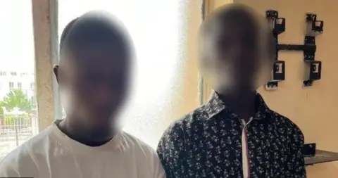 NSW Police Two blurred Nigerian men