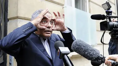 JOHANNA LEGUERRE/AFP French-Lebanese lawyer Robert Bourgi answers to journalists questions outside Europe 1 radio station on September 12, 2011 in Paris.