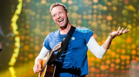 Getty Images Chris Martin of Coldplay performs live on stage at Allianz Parque on November 7, 2017 in Sao Paulo, Brazil