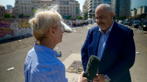 Goktay Koraltan / BBC BBC's Orla Guerin (left) talks to Beirut Governor Marwan Abboud