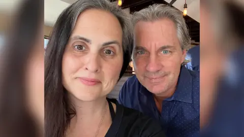 Georgia McGinty  A selfie of Georgia and John McGinty smiling at the camera