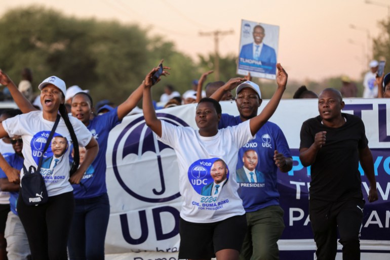 Umbrella for Democratic Change (UDC) supporters leave the final rally in Tlokweng, east of Gaborone, Botswana 